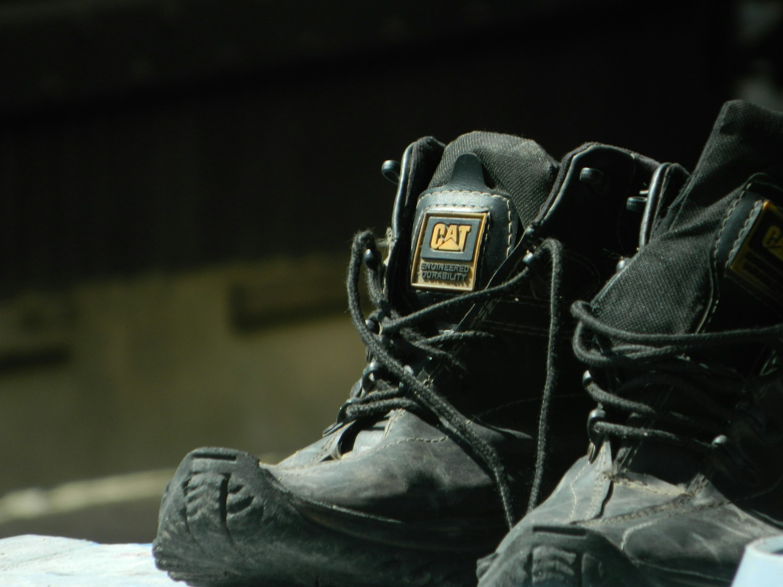 A pair of black shoes sitting on top of a table